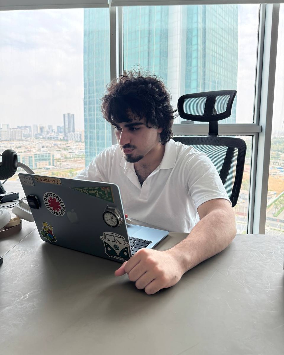 Pairaw working at a laptop